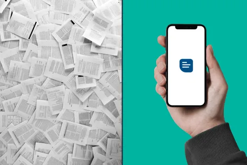 A pile of scattered paper documents beside a hand holding a phone showing the Risk Memo app
